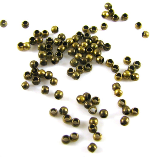 Antique Brass Crimps 1mm – 1g Bag (approx 40)